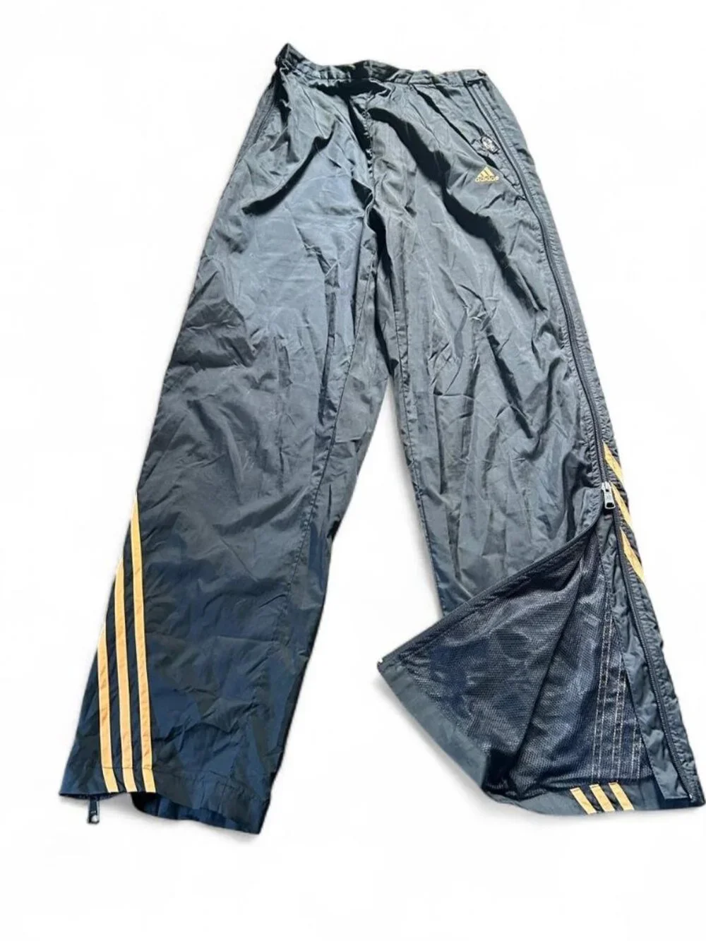 Adidas navy track pants with yellow stripes and zipper pockets size medium